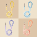 Four Pastel Dog Leashes on Beige Background